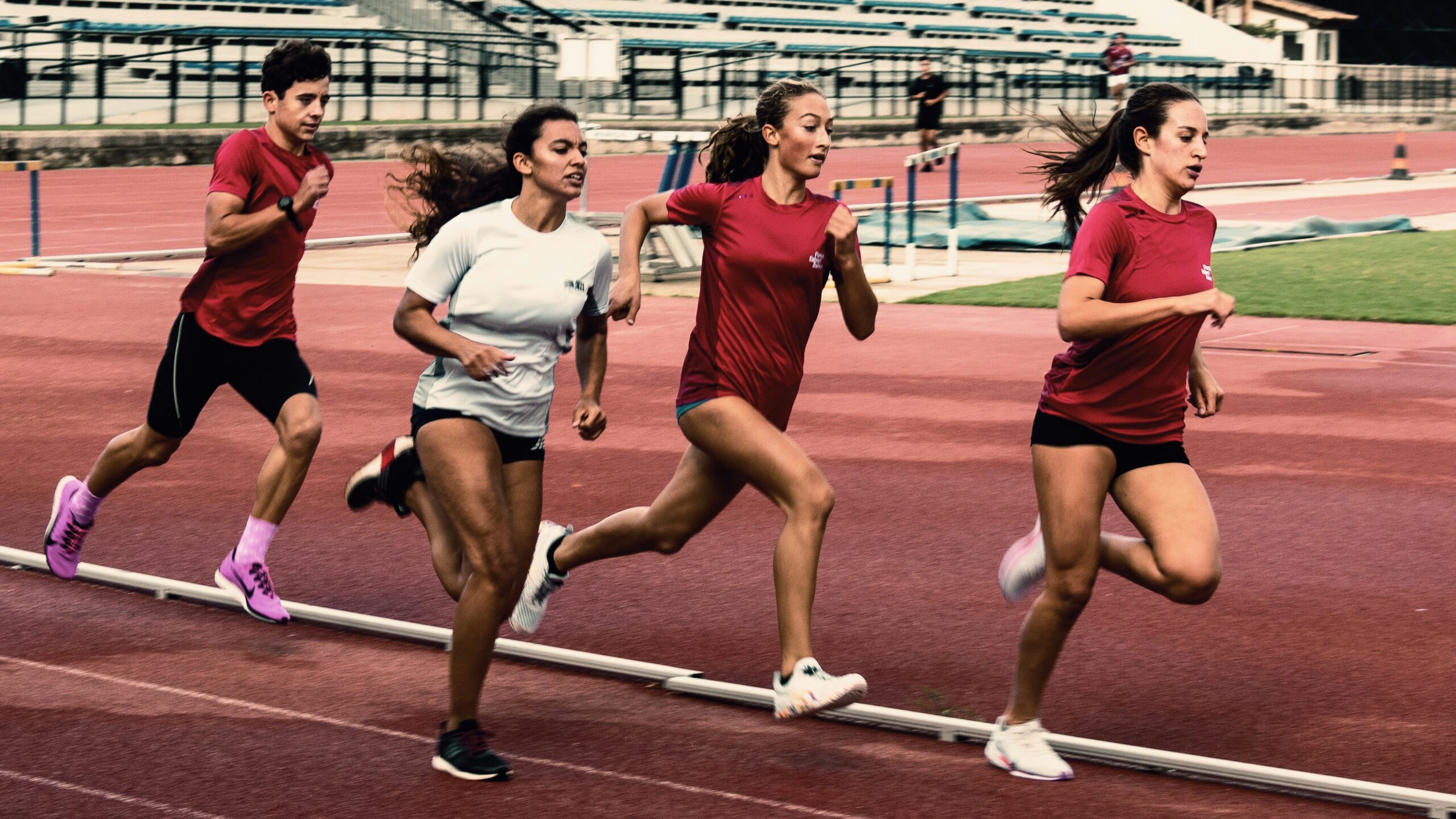 Young females running on a track
